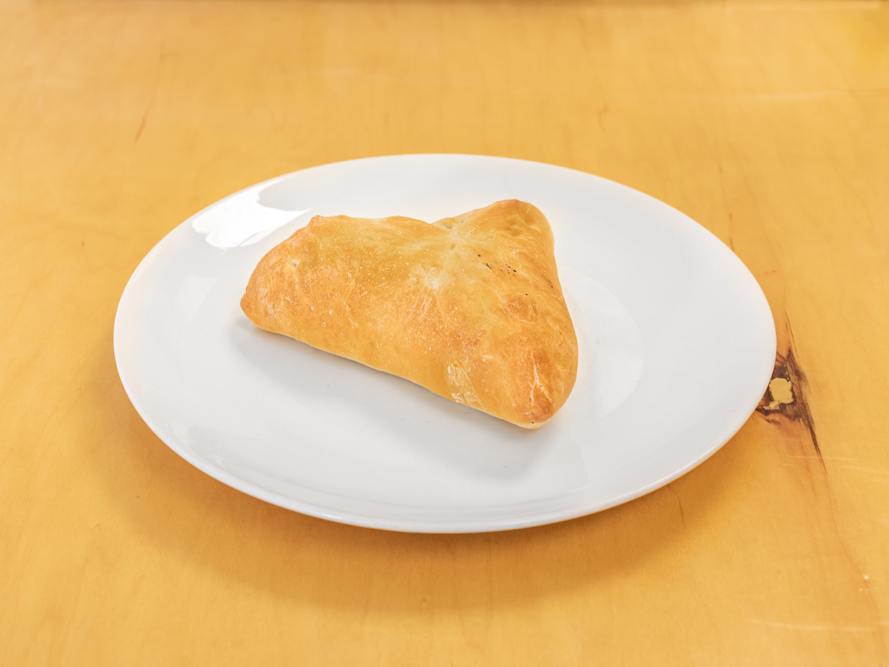 Spinach Pie, a triangular baked pie